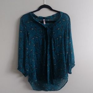Sheer blue blouse with floral detailing